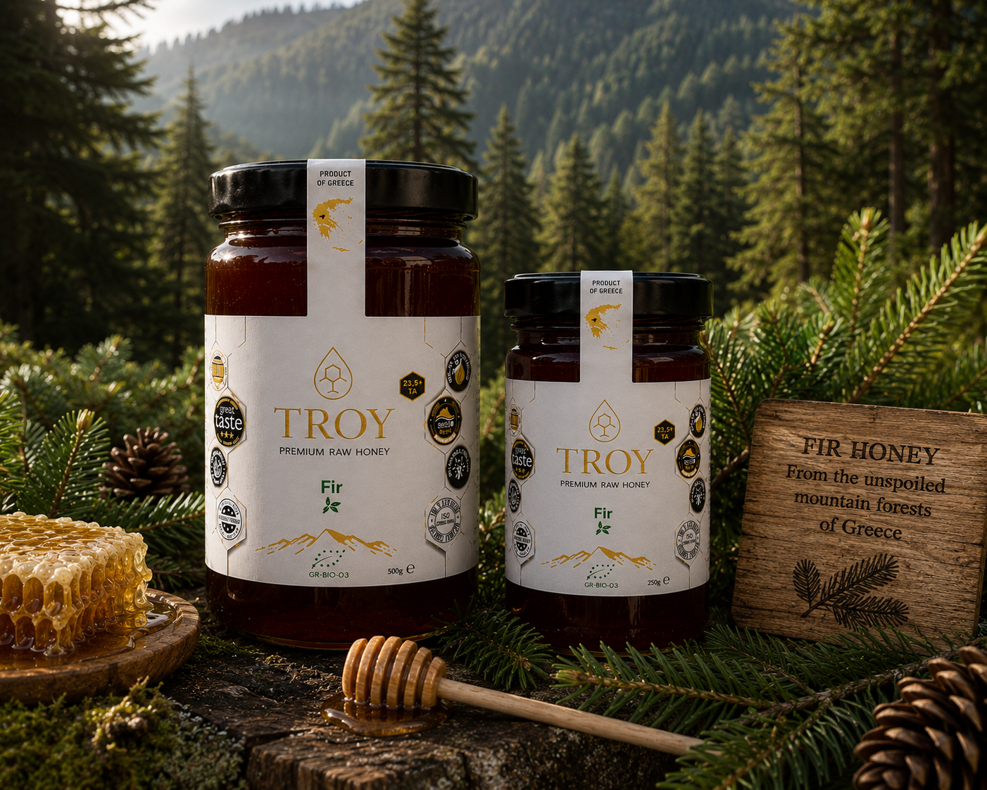 Troy Greek Raw Honey Fir Honey jars displayed in a mountain fir forest surrounded by pine cones and natural woodland scenery.